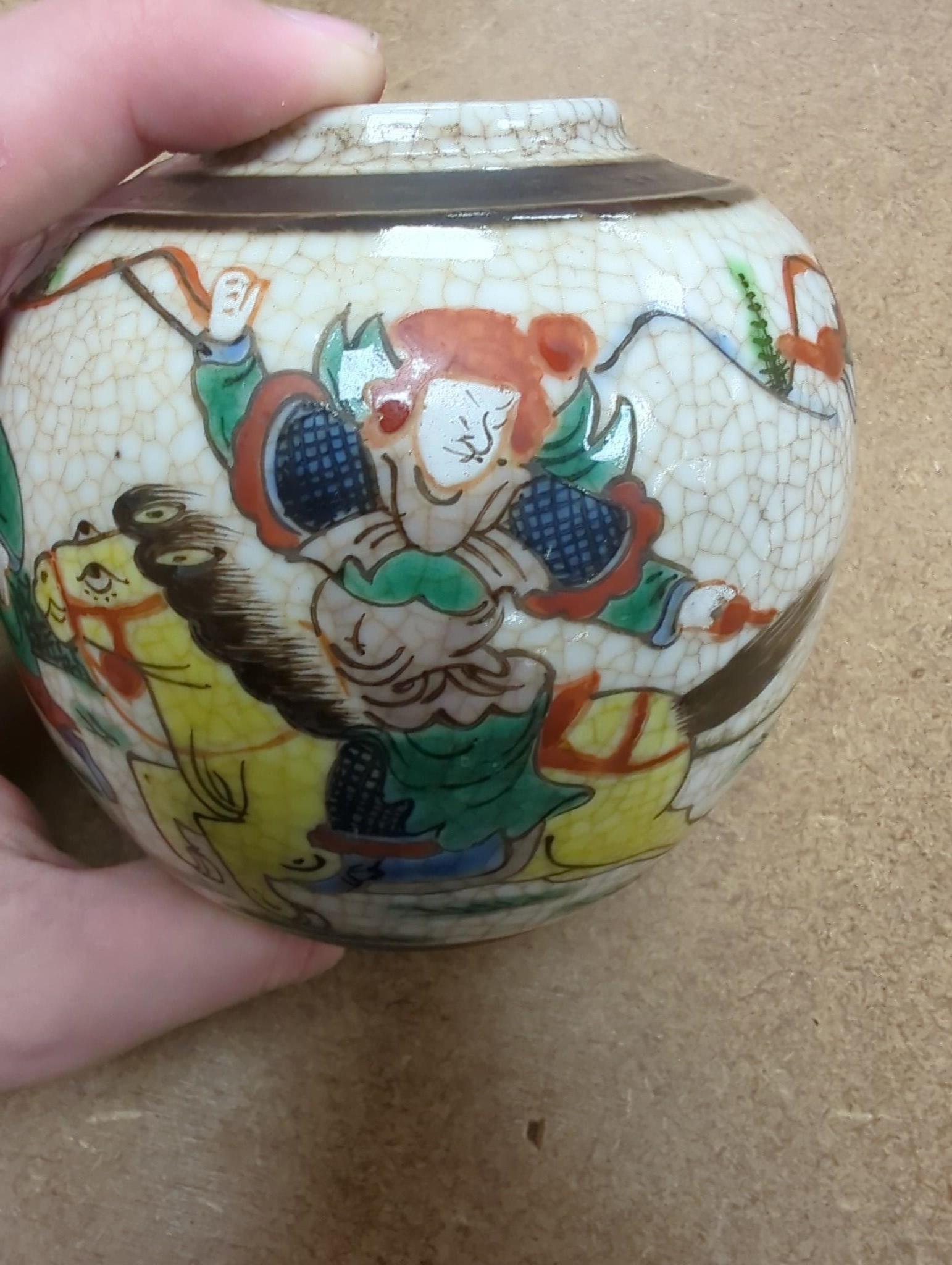 Three Chinese blue and white crackle glaze vases, a famille rose brush pot, late 19th/early 20th century, a crackle glaze ginger jar and a carved soapstone lion-dog (6)